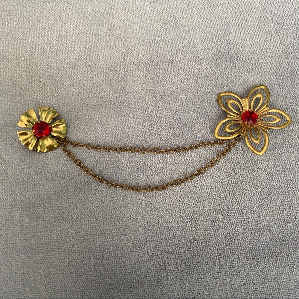 Gold-Tone Double Flower Chain Brooch with Red Stones